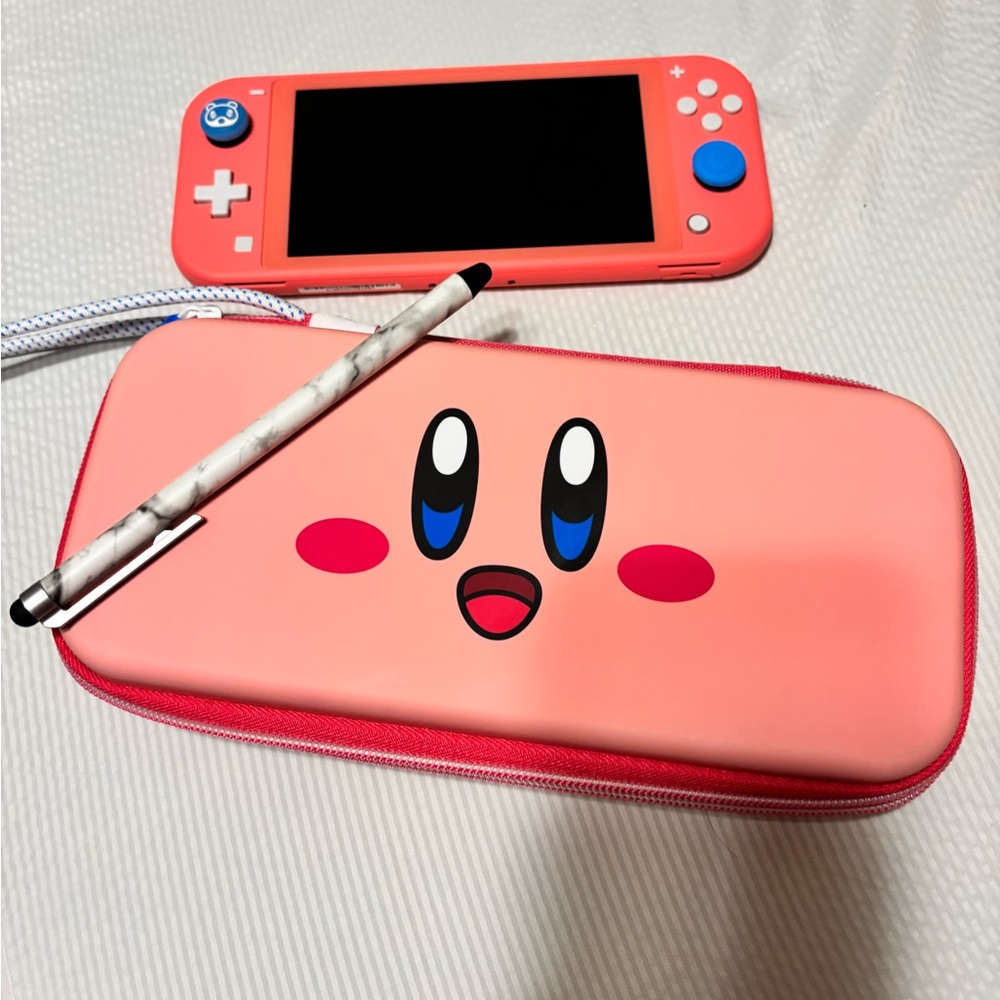 Nintendo Switch Lite Coral with Kirby Case